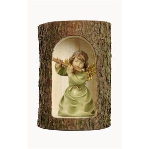 Bell angel with flute in a tree trunk