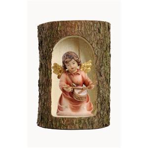 Bell angel with drum in a tree trunk
